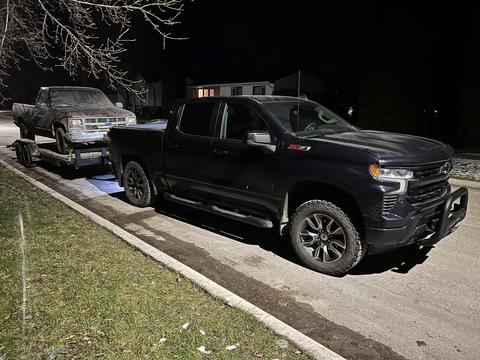 Nighttime Scrap Vehicle Transport with Pickup Truck and Trailer