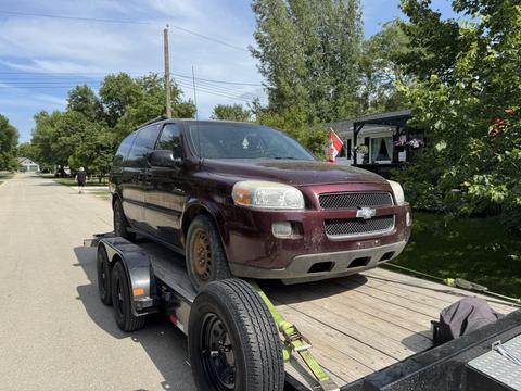 Old Van Loaded on Trailer for Scrap Metal Recycling