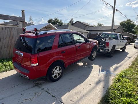 Towing Service Collecting Scrap Vehicle in Residential Area