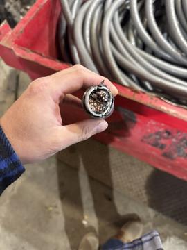 Inspecting Copper Wires for Recycling at Scrap Metal Facility