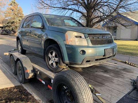 SUV Loaded on Trailer for Scrap Metal Recycling