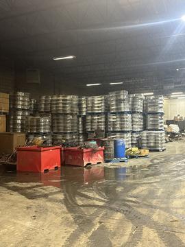 Scrap Metal Recycling Facility with Stacked Materials and Containers