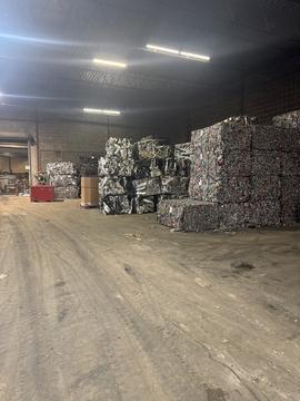 Efficient Scrap Metal Recycling Facility with Stacked Bales