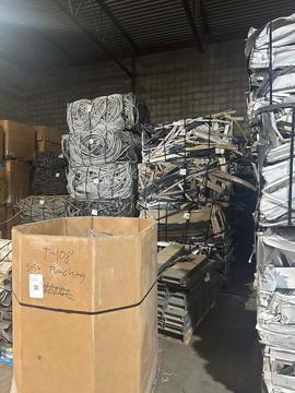 Scrap Metal Recycling Facility with Stacked Materials and Containers