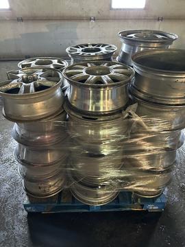 Stacked Aluminum Wheels Ready for Scrap Metal Recycling
